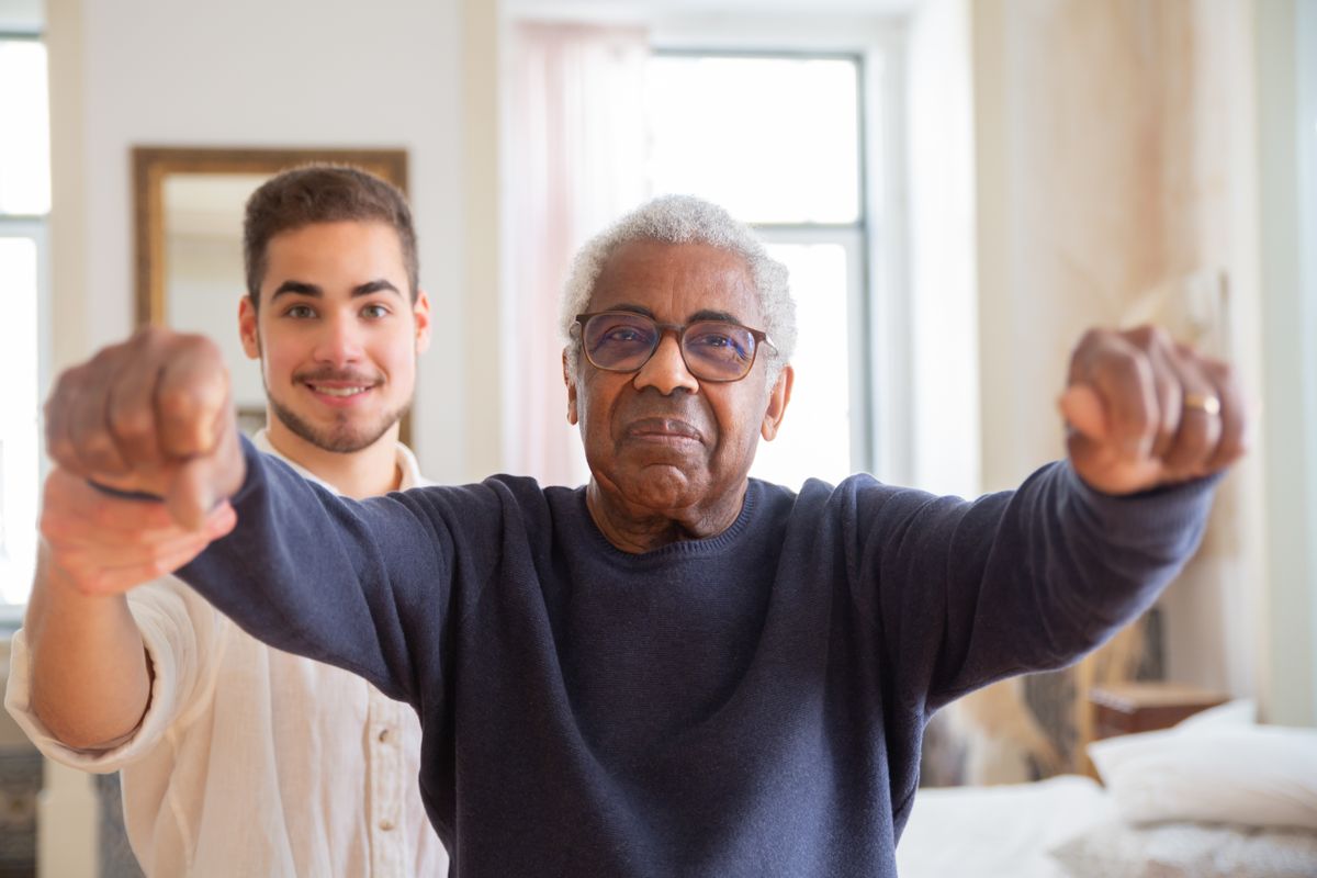 Home health aide assisting a patient